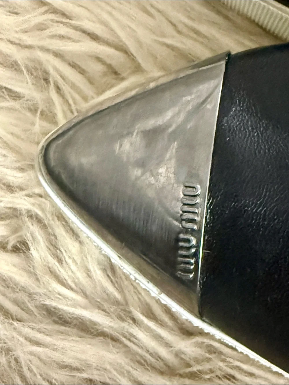 Miu Miu Black Leather Slip-On Sneakers with Silver Cap Toe